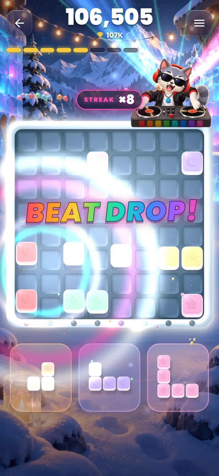 A Beat Drop at the Ice Party: the rainbow word over the board, rings of light rolling out from the clear